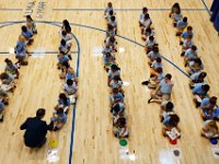 00023955A ma nb AlmadelMar1stDay  School executive director, Will Gardner, fist-pimps a new kindergarten student waiting for morning routines to begin on the first day of school at the Alma del Mar's new school on Belleville Avenue in the north end of New Bedford.   PETER PEREIRA/THE STANDARD-TIMES/SCMG : school, education